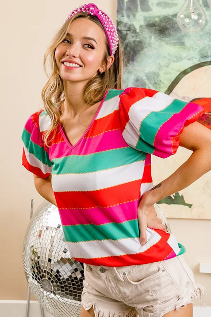 Red, fuchsia, and green multi-stripe print V-neck top with puff sleeves from Trendsi featuring a stylish, colorful design.