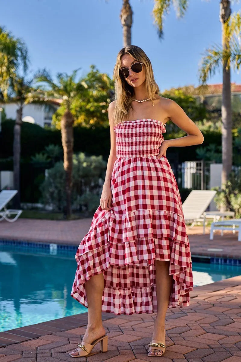 Red and ivory checkered BiBi Smocked Body Off Shoulder Dress by Trendsi, featuring a fitted smocked bodice and off-shoulder design.