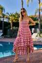 Red and ivory checkered BiBi Smocked Body Off Shoulder Dress by Trendsi, featuring a fitted smocked bodice and off-shoulder design.