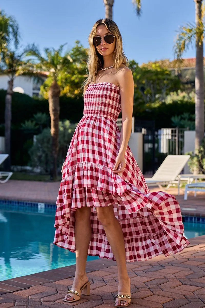 Red and ivory checkered BiBi Smocked Body Off-Shoulder Dress by Trendsi, featuring a fitted smocked bodice and off-shoulder neckline.