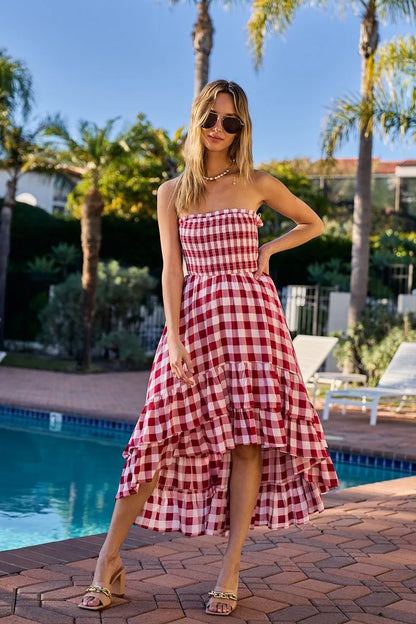 Red and ivory off-shoulder check dress with smocked bodice from BiBi by Trendsi, featuring a stylish, relaxed fit.