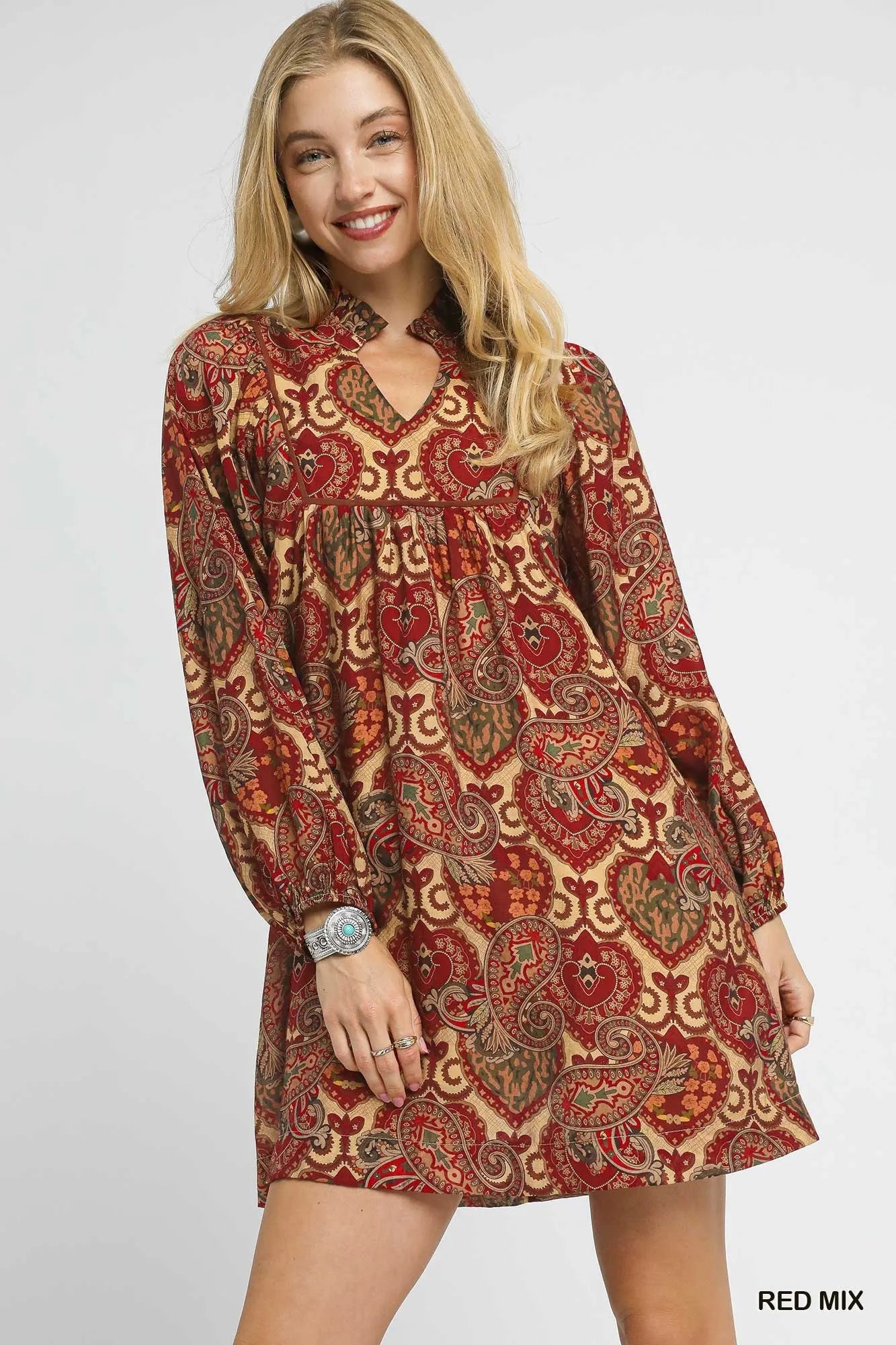Red and white boho paisley babydoll dress by Umgee featuring a flowy silhouette and relaxed fit, worn with a casual, bohemian style.