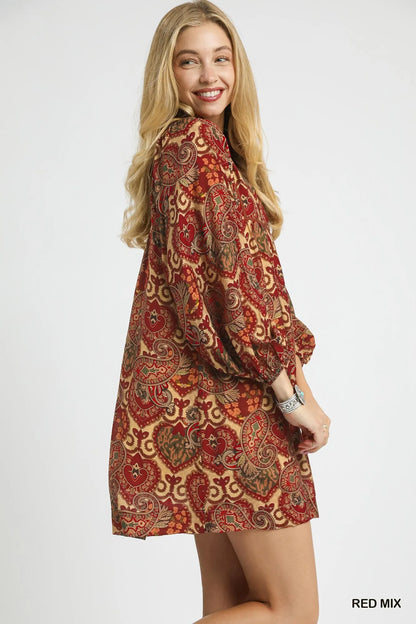Red boho paisley babydoll dress by Umgee featuring a relaxed fit and flowy silhouette, styled with long sleeves and a V-neck.