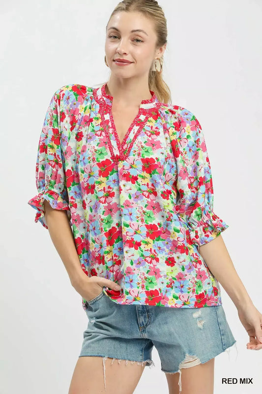 Red floral print ruffle top by Umgee with mixed floral pattern and feminine ruffle details, perfect for casual or dressy occasions.