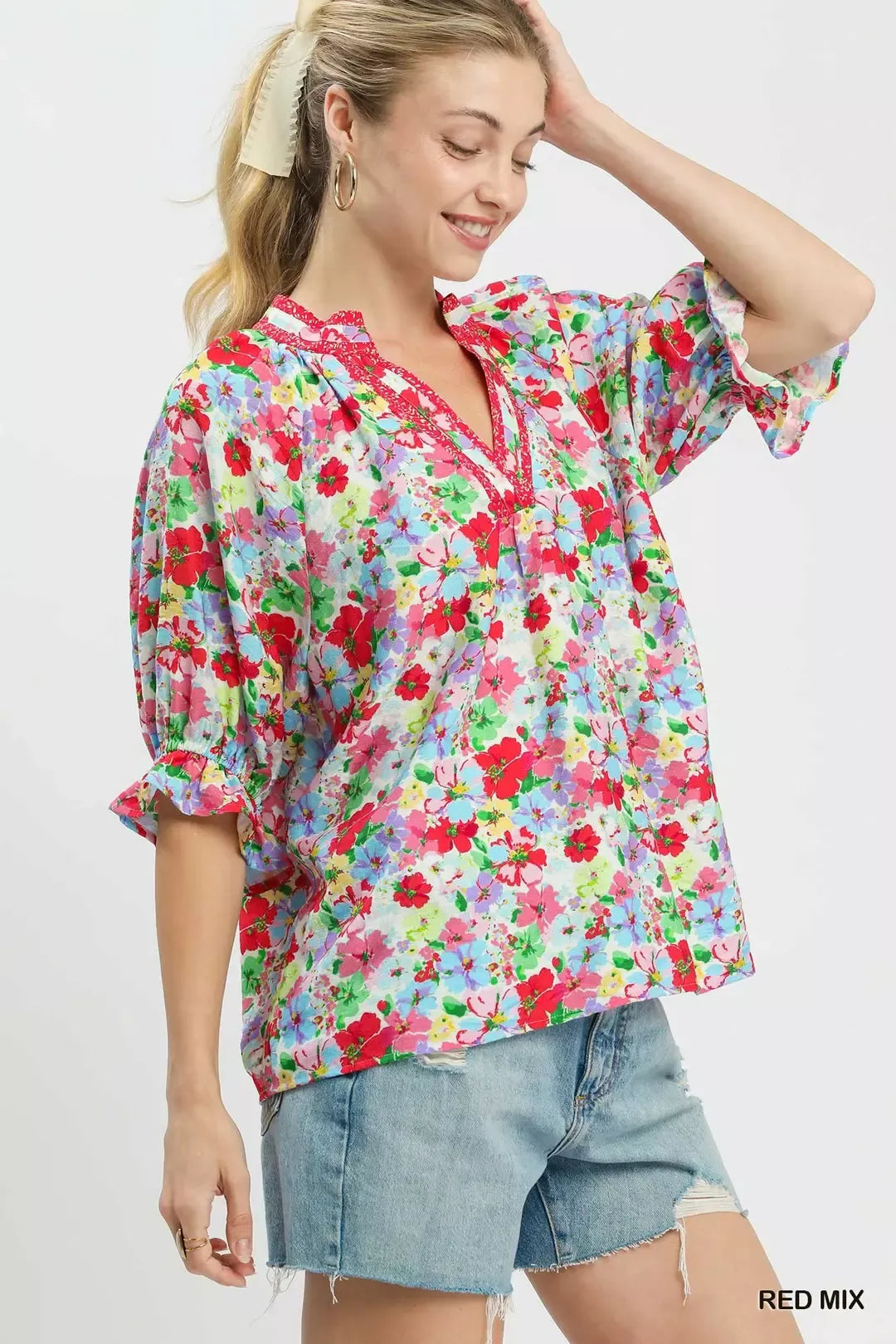 Red floral print ruffle top by Umgee, featuring a mixed pattern and feminine ruffle details, perfect for casual or dressy looks.