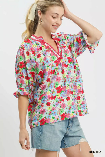 Red floral print ruffle top by Umgee, featuring a mixed pattern and feminine ruffle details, perfect for casual or dressy looks.