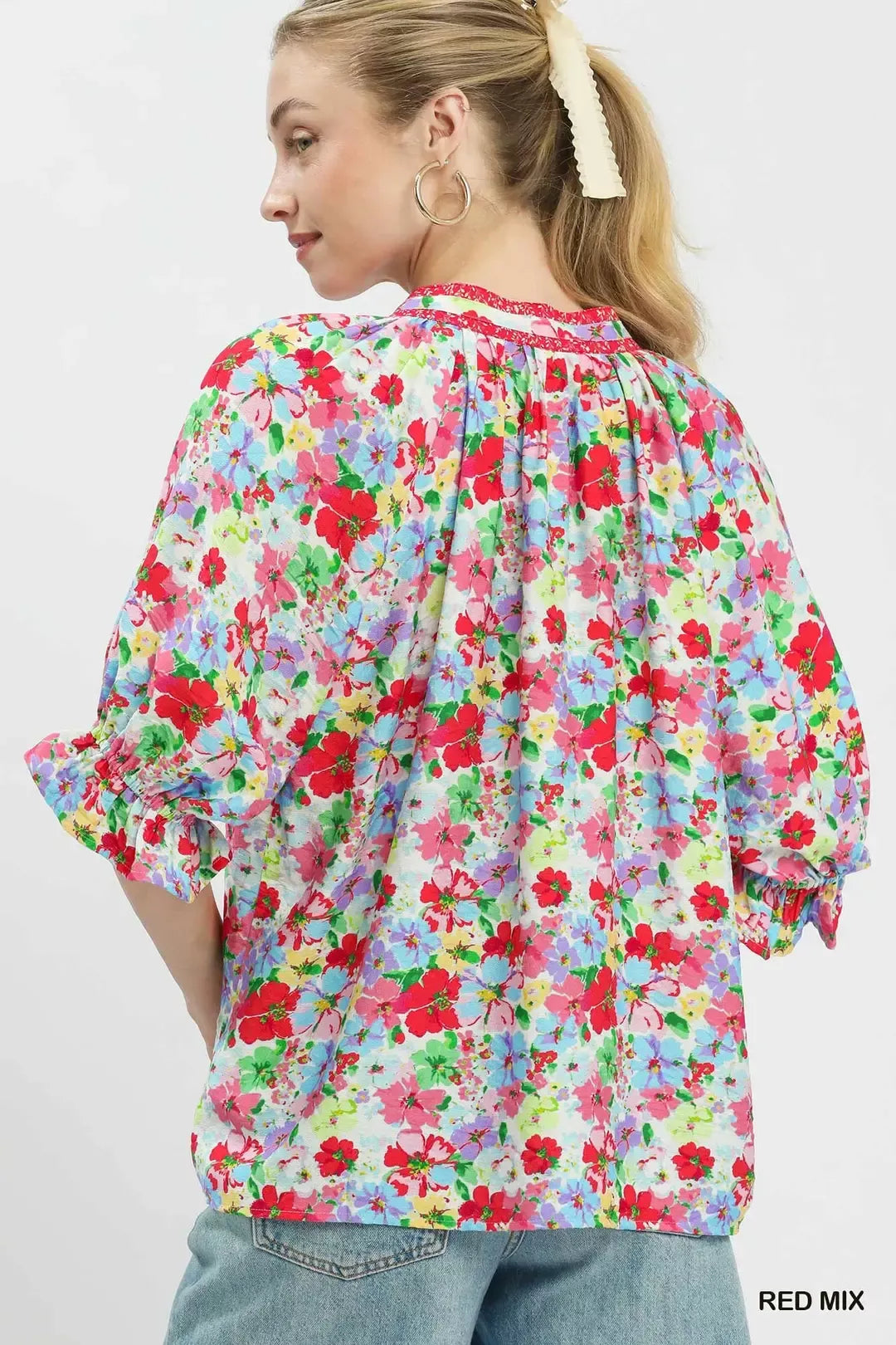 Red Umgee floral print ruffle top with mixed floral pattern, short sleeves, and ruffled details, perfect for casual or dressy wear.