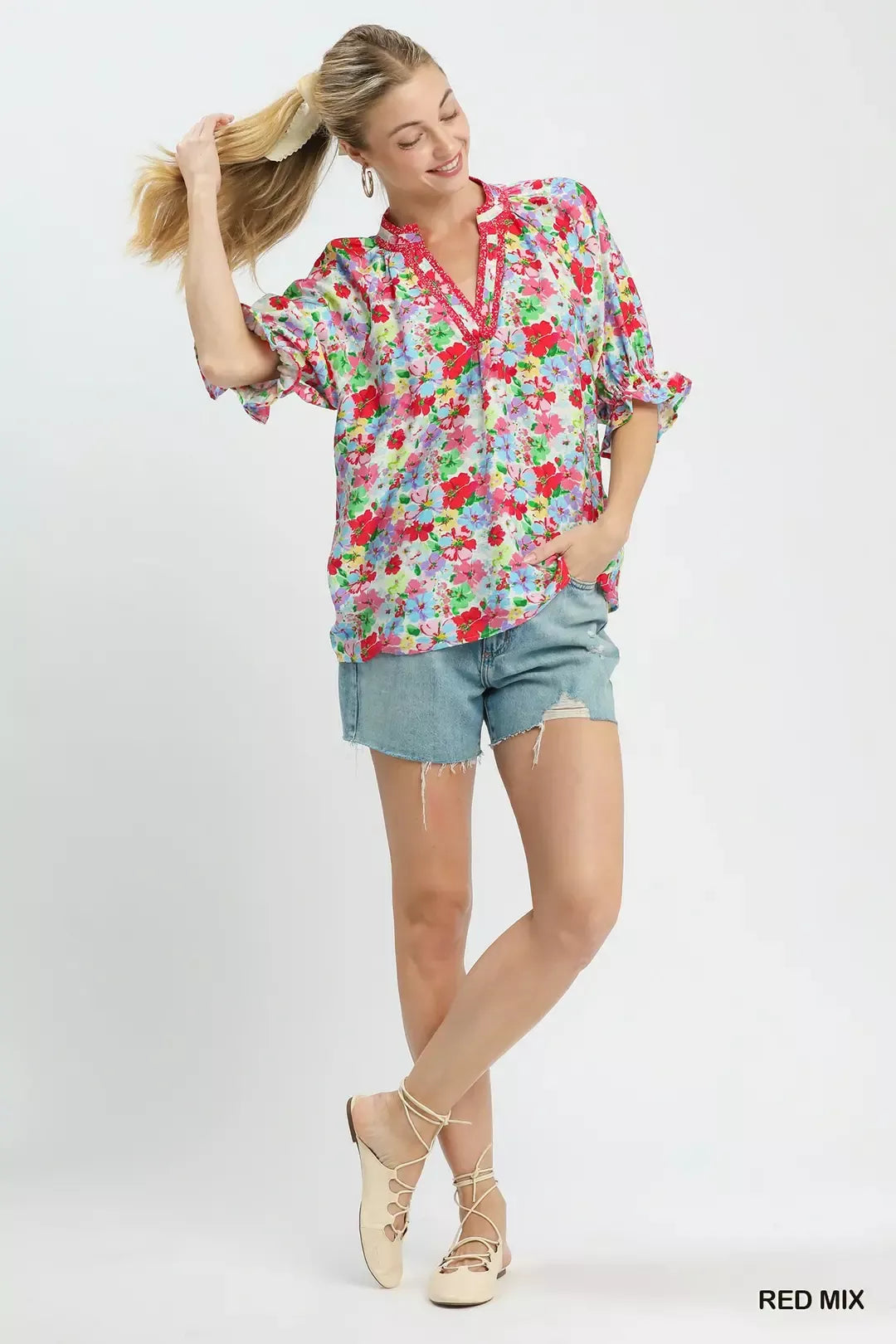 Red floral print ruffle top by Umgee, featuring a mixed floral pattern and feminine ruffle details, perfect for casual wear.