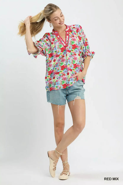 Red floral print ruffle top by Umgee, featuring a mixed floral pattern and feminine ruffle details, perfect for casual wear.