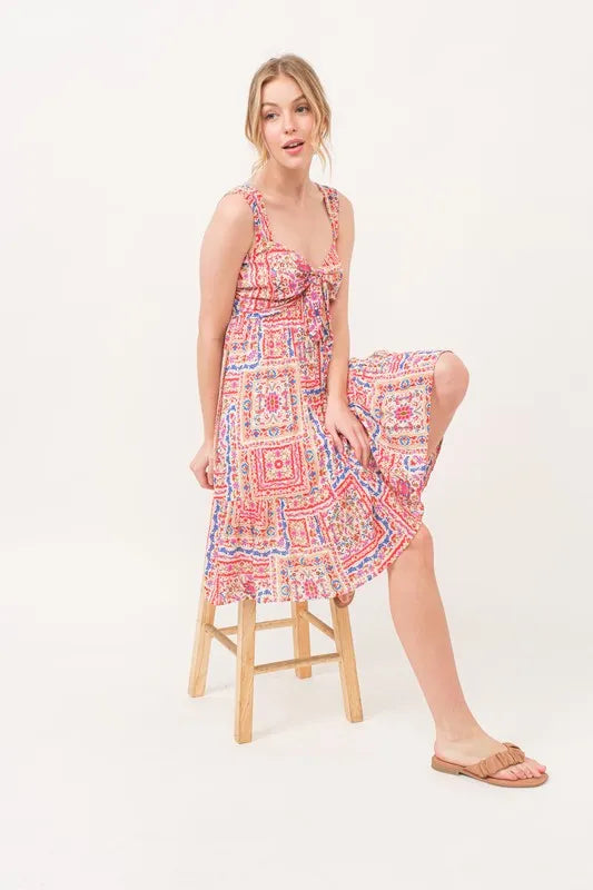 Red multi-colored boho printed dress with tied front, smocked back, and tiered design by Trendsi.