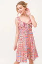 Red multi-color boho printed dress with tied front and smocked back, featuring a tiered design by Trendsi.