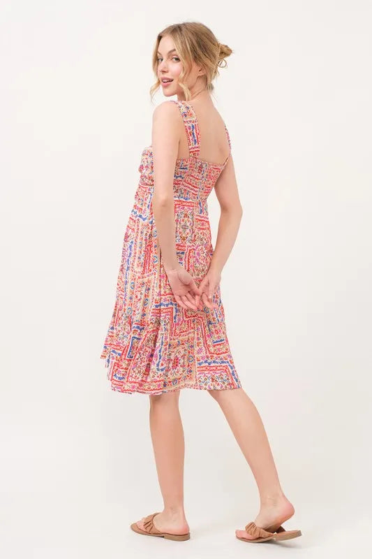 Red multi-colored boho printed dress with tie-front, smocked back, and tiered design by Trendsi.