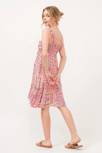 Red multi-colored boho printed dress with tie-front, smocked back, and tiered design by Trendsi.