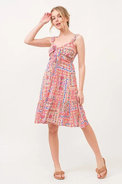 Red multicolor boho printed dress with tie-front and smocked back, tiered design, from Trendsi's And The Why collection.