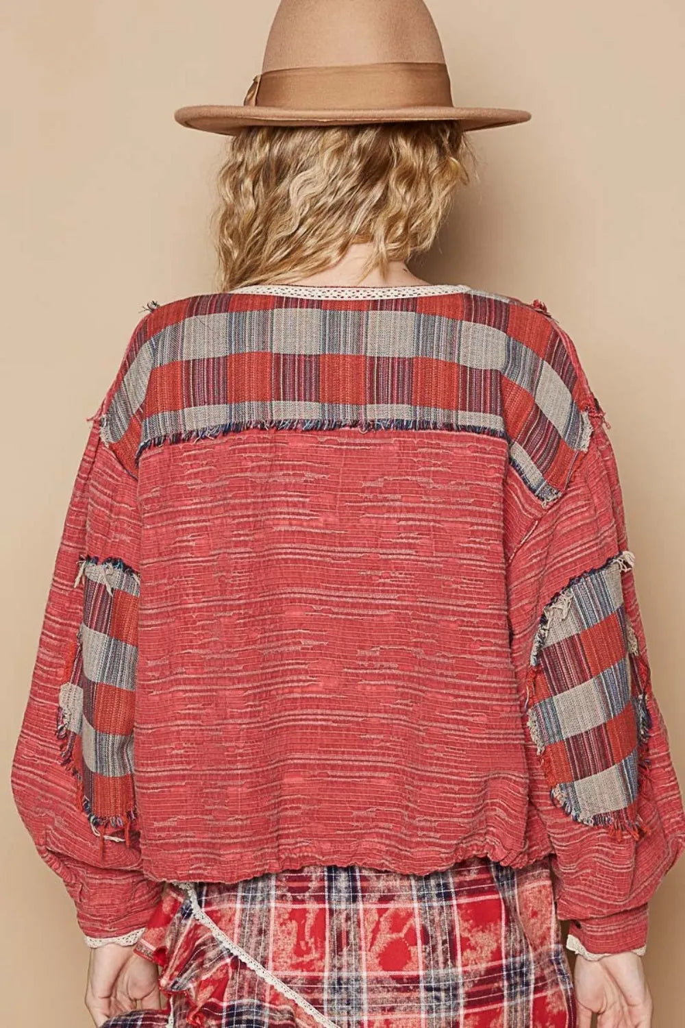 Red and multi-color plaid long sleeve shirt with a round neck from Trendsi, styled casually on a model.