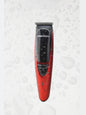 Red cordless rechargeable hair clipper by Trendsi with a sleek design, ideal for easy home haircutting.