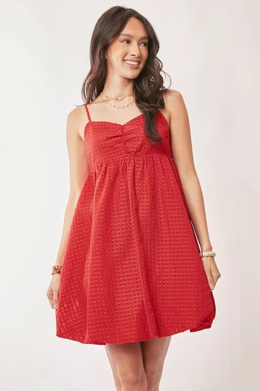 Red Davi & Dani textured sweetheart neckline bubble hem dress with short sleeves, stylish and feminine for special occasions.
