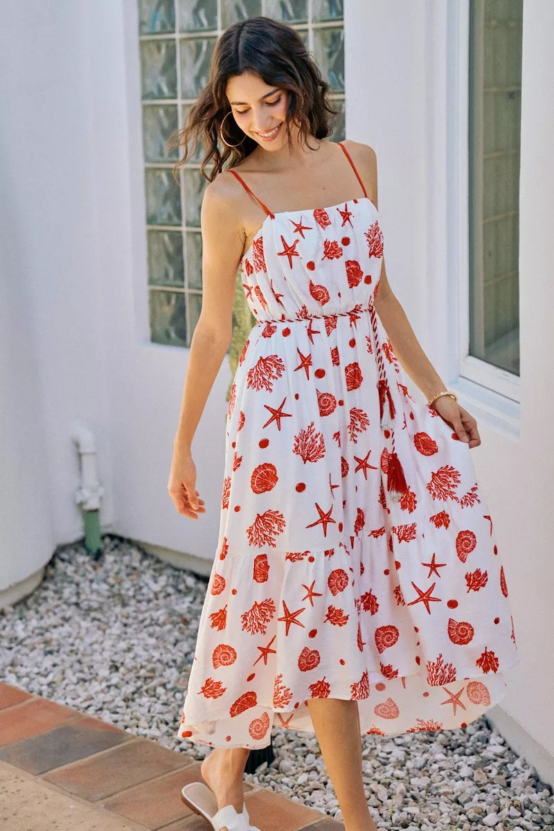 Red SO ME shell print tiered lined midi cami dress with belt, stylishly displayed on a hanger.
