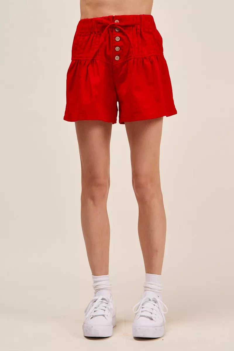 Red Trendsi SO ME solid twill denim pintucked buttoned shorts with waist tie, showing front view and stylish design.