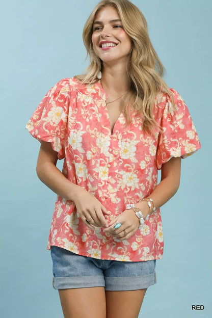 Red Umgee floral button-front short sleeve shirt with a relaxed fit, featuring a classic collar and vibrant floral pattern.
