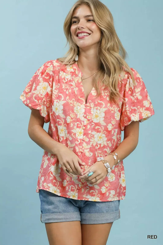 Red Umgee floral button-front short sleeve shirt with a relaxed fit, featuring a classic collar and vibrant floral pattern.