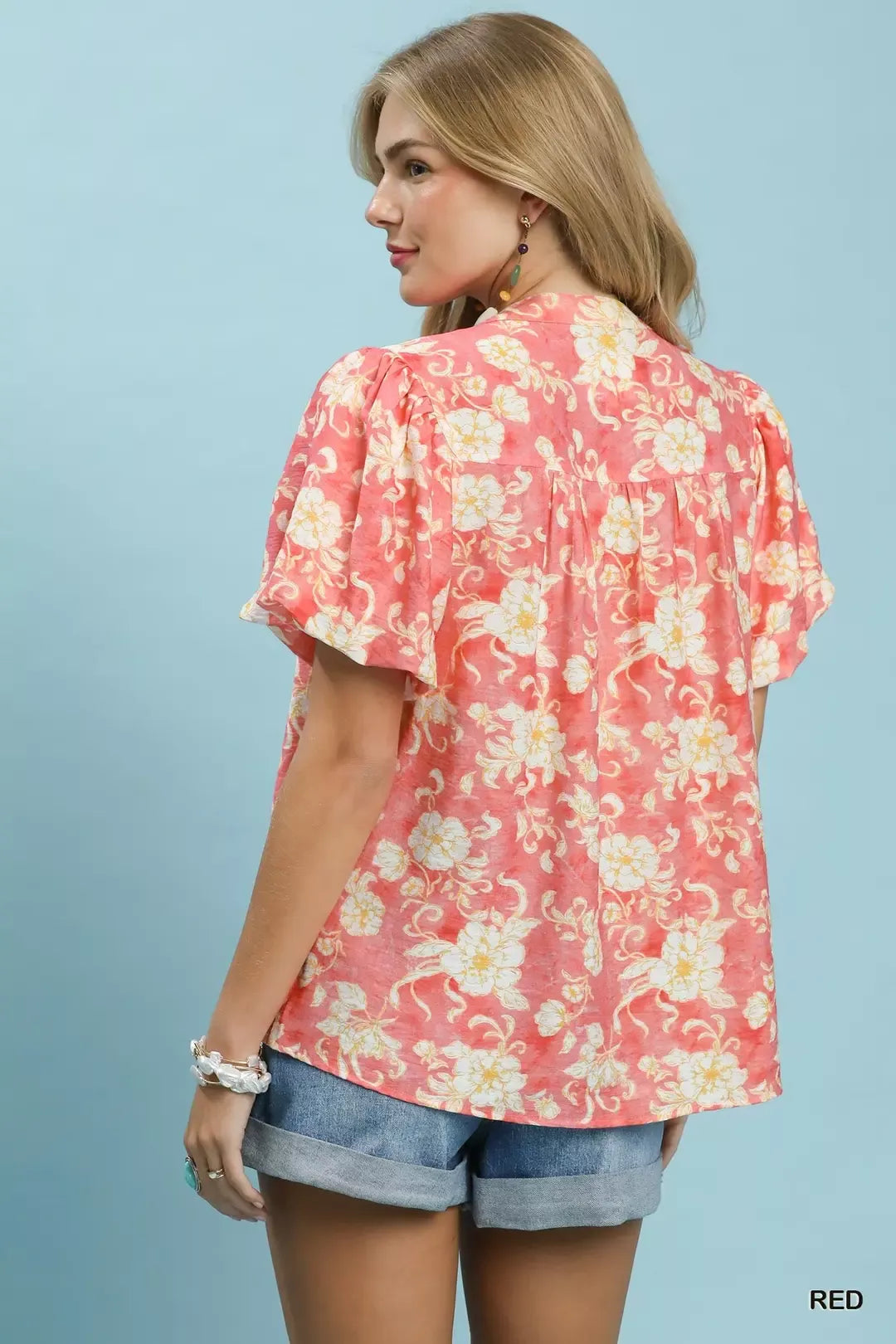 Red Umgee floral button-front short sleeve shirt featuring a classic collar and vibrant floral print, perfect for casual wear.