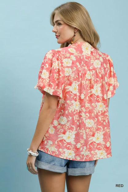 Red Umgee floral button-front short sleeve shirt featuring a classic collar and vibrant floral print, perfect for casual wear.