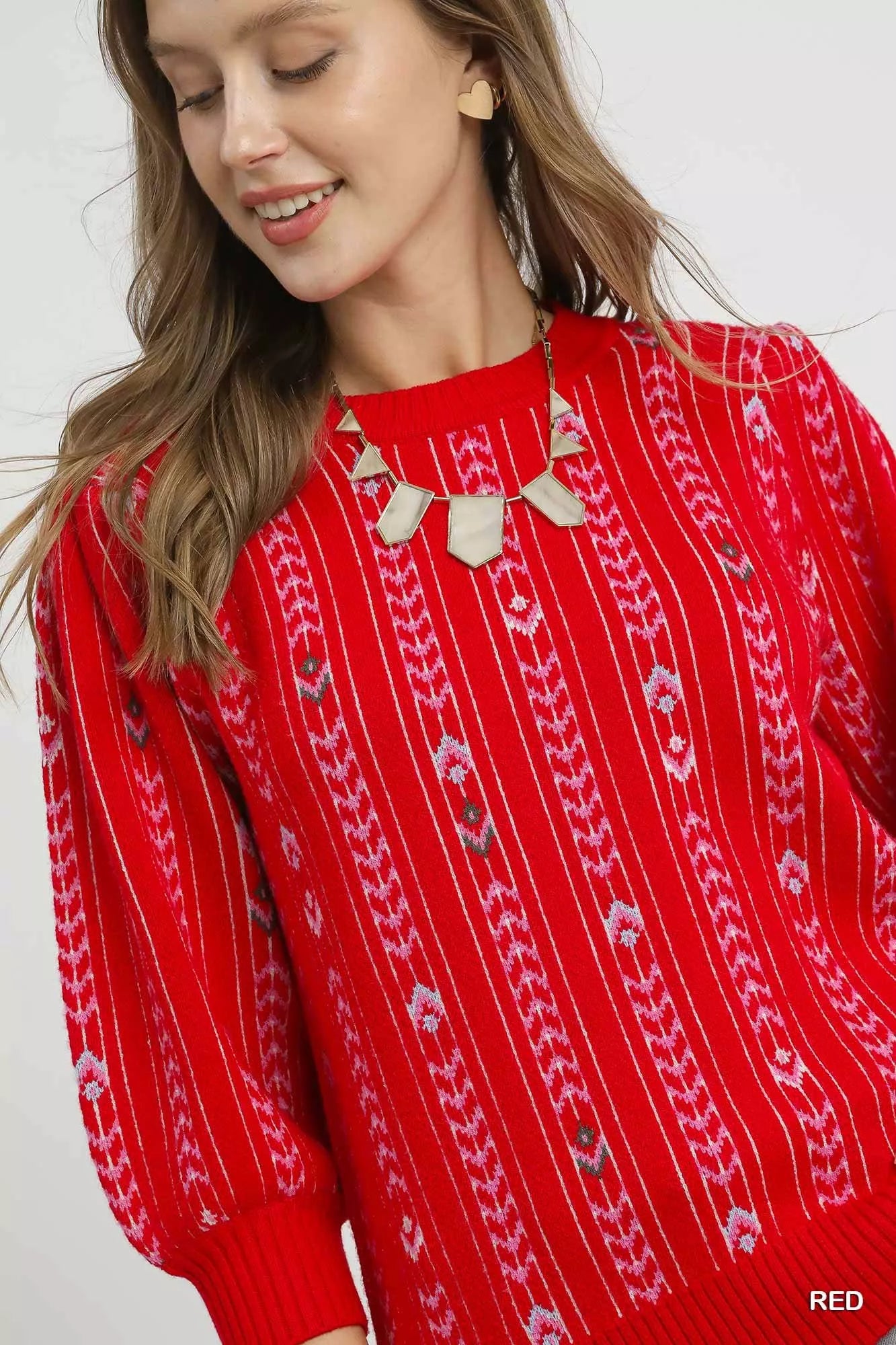 Red Umgee Jacquard Knit Puff Sleeve Sweater with intricate pattern and cozy fit, styled for casual or chic looks.
