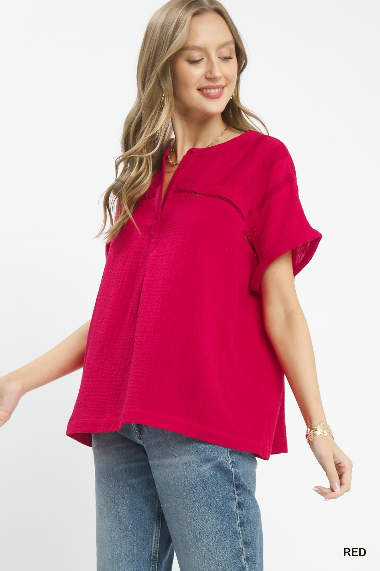 Red Umgee textured gauze boho blouse with a split neckline, featuring a relaxed fit and stylish details.