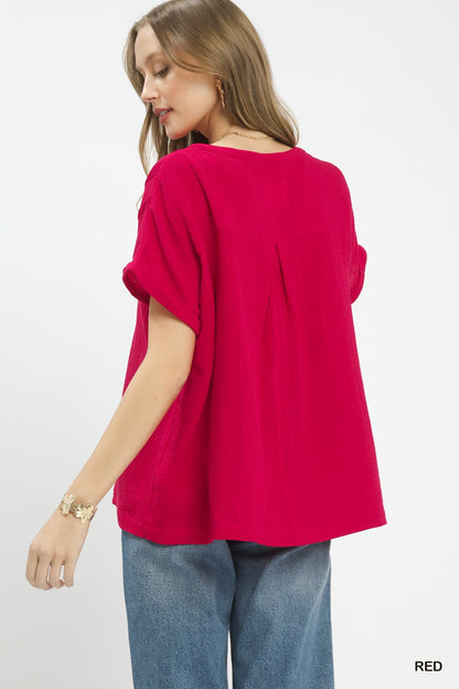 Red Umgee textured gauze boho blouse with a split neckline, featuring a relaxed fit and casual style.