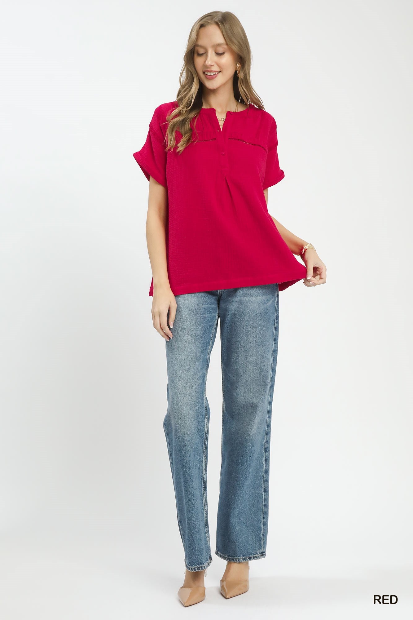 Red Umgee textured gauze boho blouse with split neck and relaxed fit, styled in a casual, trendy look.