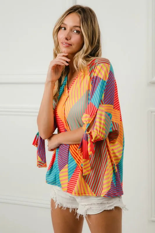 Trendsi BiBi multi stripe block printed jersey blouse with tied sleeves, in red, yellow, and green colors.
