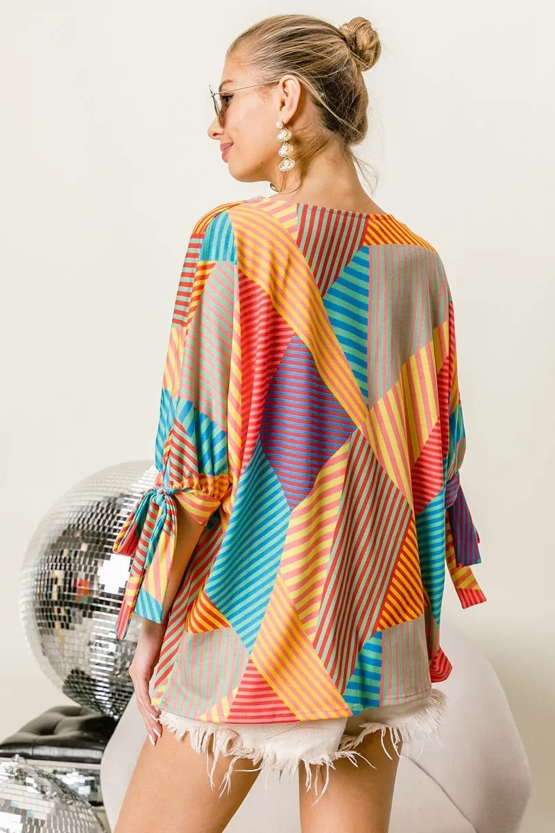 Trendsi BiBi multi stripe block printed jersey blouse with tied sleeves, featuring red, yellow, and green colors.