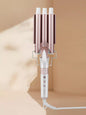 Rose gold 3-barrel hair curling iron from Trendsi with European plug for creating defined, beachy waves or tight curls.