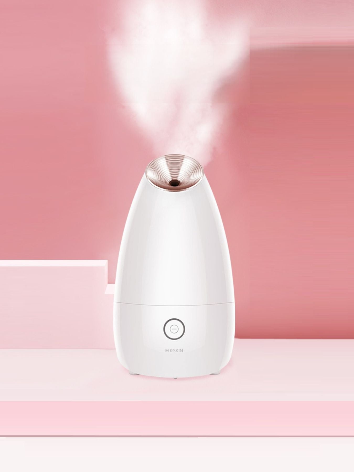 Rose gold facial steamer deep cleansing beauty device by Trendsi, showing the compact, sleek design with steam outlet for skincare treatment.