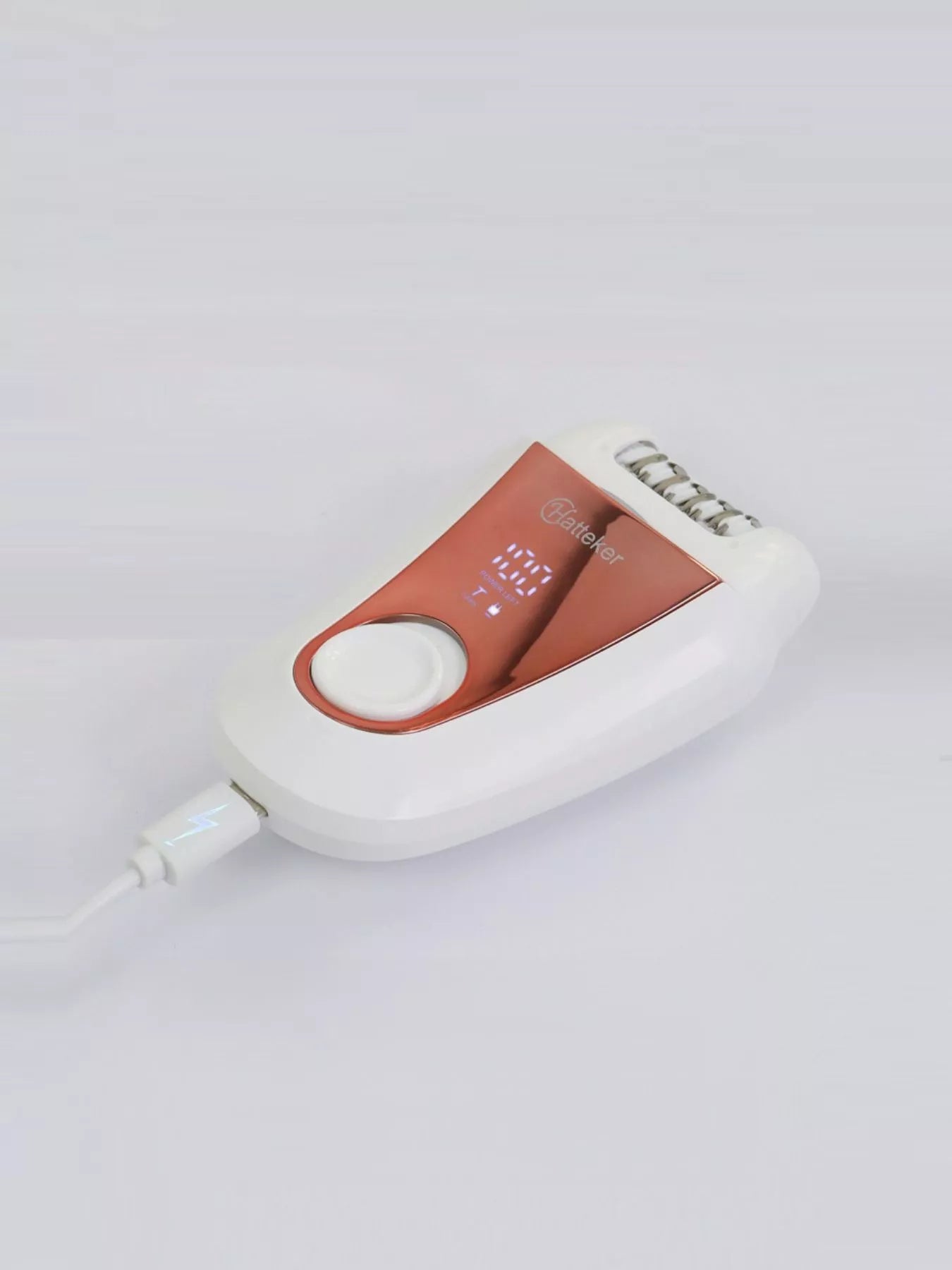 Rose gold rechargeable hair removal epilator by Trendsi with sleek design and multiple attachment heads for efficient hair removal.