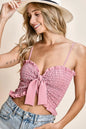 Pink BiBi ruffled smocked ribbon detail cami top from Trendsi, featuring ruffles and smocking for a feminine, stylish look.