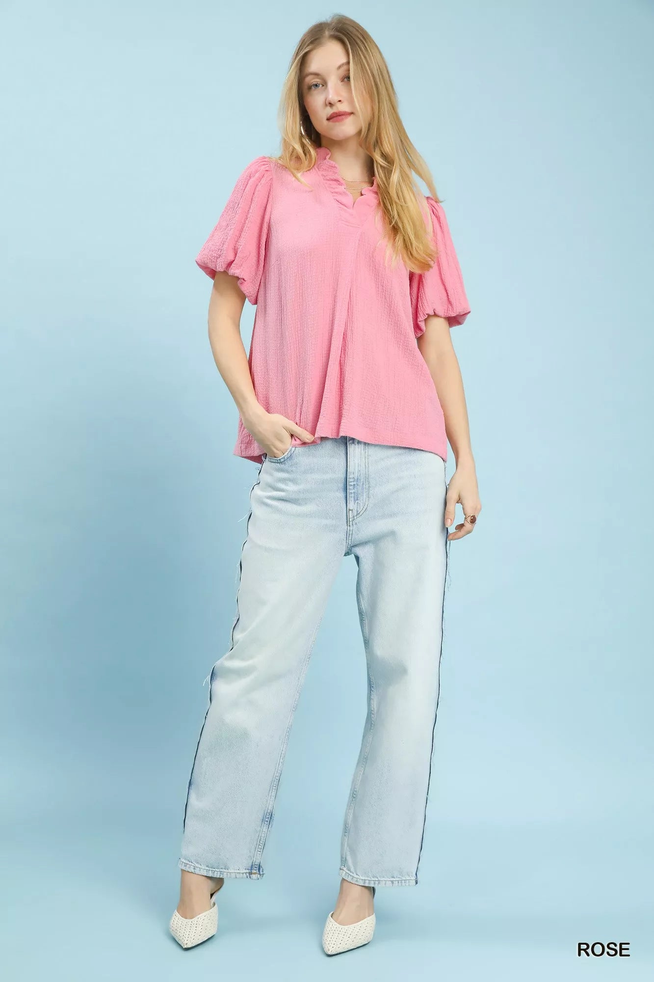 Pink Umgee Seersucker Puff Sleeve Blouse with ruffled collar and puffed sleeves, displayed on a hanger.