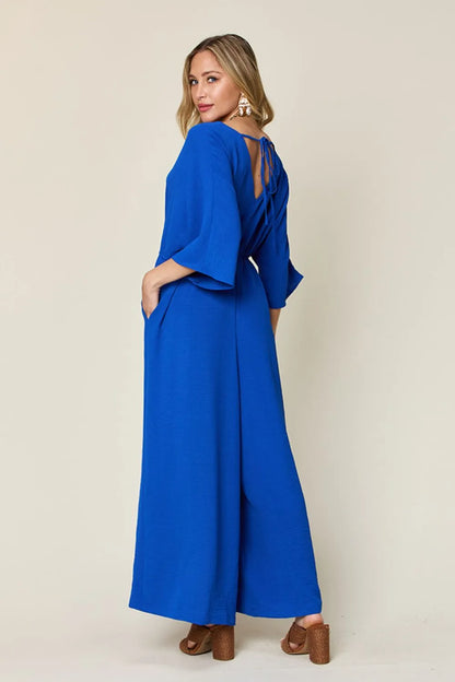 Royal blue Trendsi Double Take full-size surplice jumpsuit with wide-leg design and side pockets, stylish and comfortable.