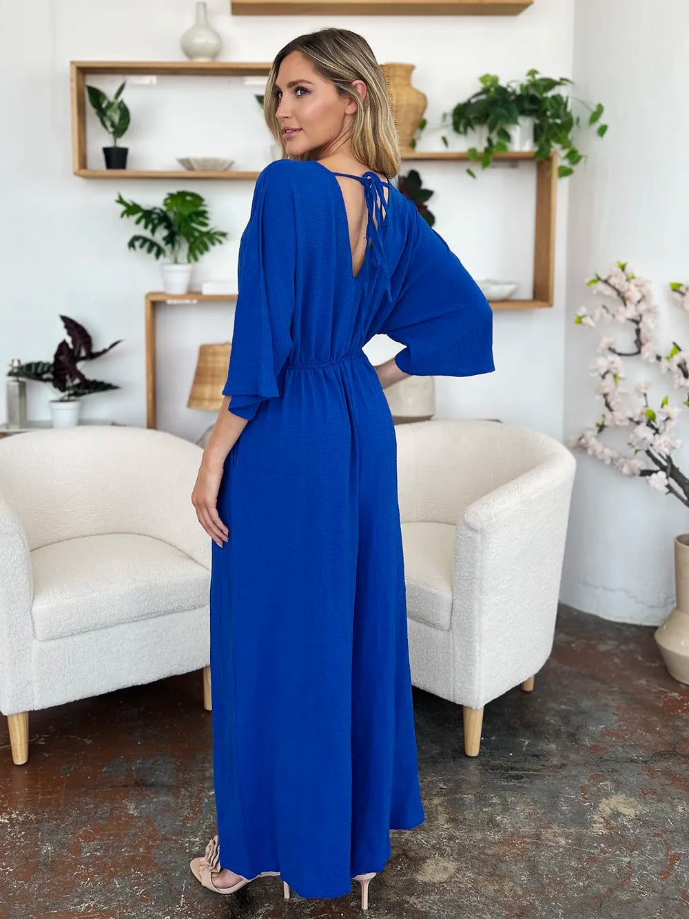Royal blue Trendsi Double Take full-size surplice jumpsuit with wide legs and pockets, styled for a modern, casual look.