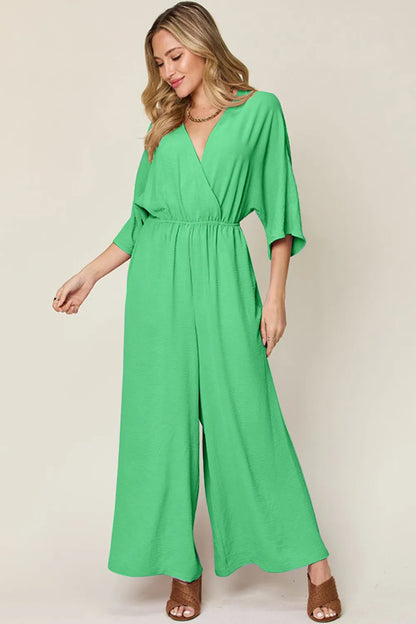Royal blue Trendsi double take full-size surplice wide-leg jumpsuit with pockets, featuring a stylish, comfortable fit.