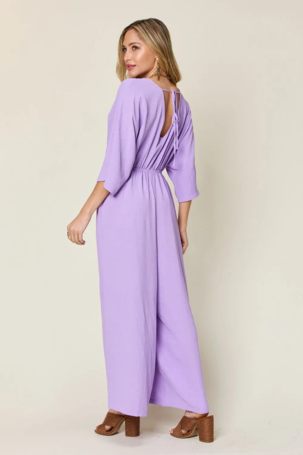 Royal blue Trendsi double take full-size surplice wide-leg jumpsuit with pockets, featuring a stylish and comfortable design.