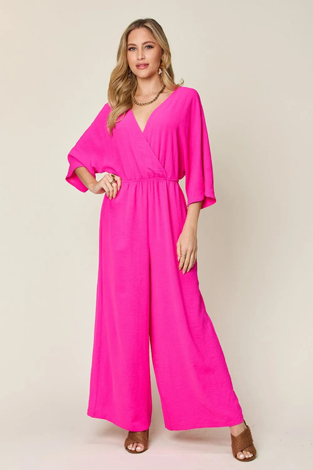 Royal blue Trendsi Double Take full-size surplice wide-leg jumpsuit with pockets, featuring a stylish fitted bodice and flowing legs.