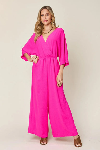 Royal blue Trendsi Double Take full-size surplice wide-leg jumpsuit with pockets, featuring a stylish fitted bodice and flowing legs.