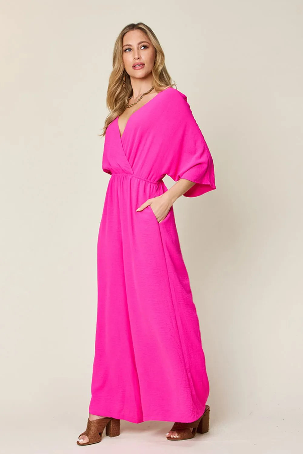 Royal blue Trendsi double take full size surplice wide-leg jumpsuit with pockets, featuring a stylish wrap design and comfortable fit.