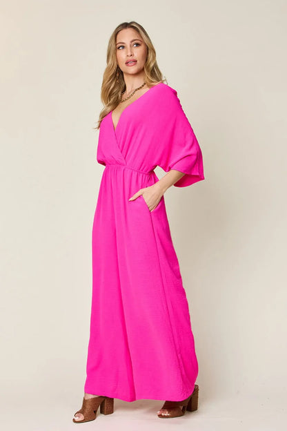 Royal blue Trendsi double take full size surplice wide-leg jumpsuit with pockets, featuring a stylish wrap design and comfortable fit.