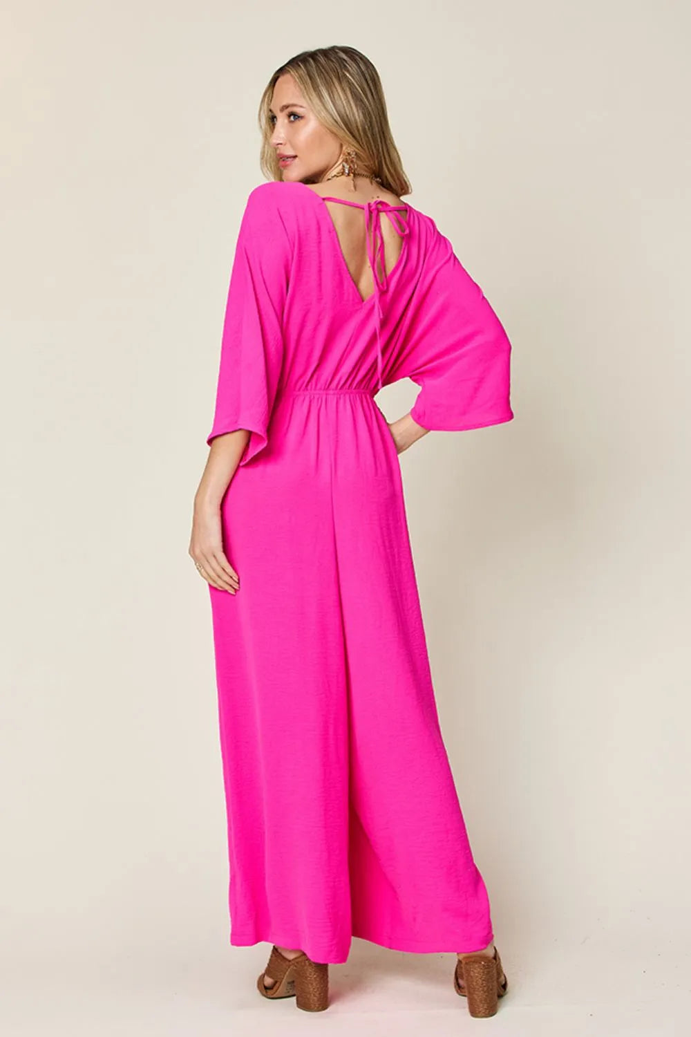 Royal blue Trendsi Double Take full-size surplice wide-leg jumpsuit with pockets, featuring a stylish surplice neckline and comfortable fit.