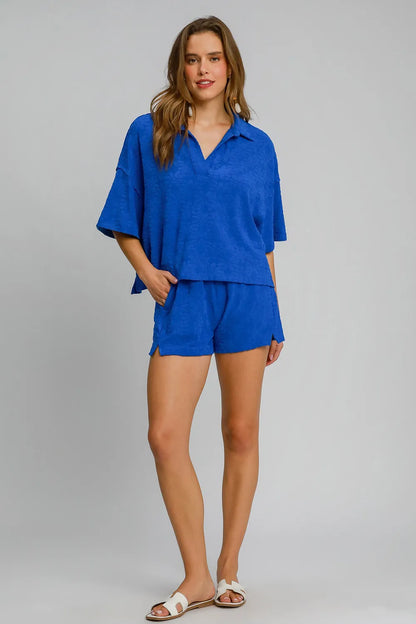 Royal blue Umgee floral jacquard shorts with elastic waist and pockets, featuring a stylish and comfortable design.