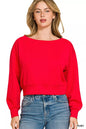 Zenana scuba cropped boat neck sweatshirt from Trendsi, featuring a relaxed fit and comfortable fabric in a stylish pullover design.