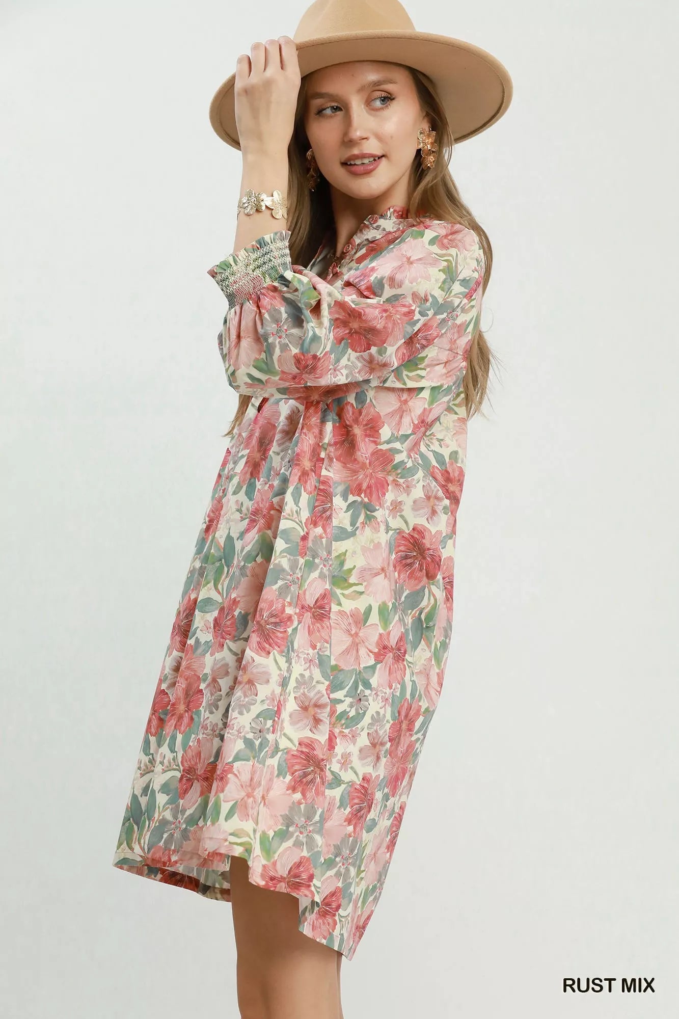 Rust-colored Umgee floral print mini dress with smocked cuffs and a relaxed fit, perfect for casual wear.